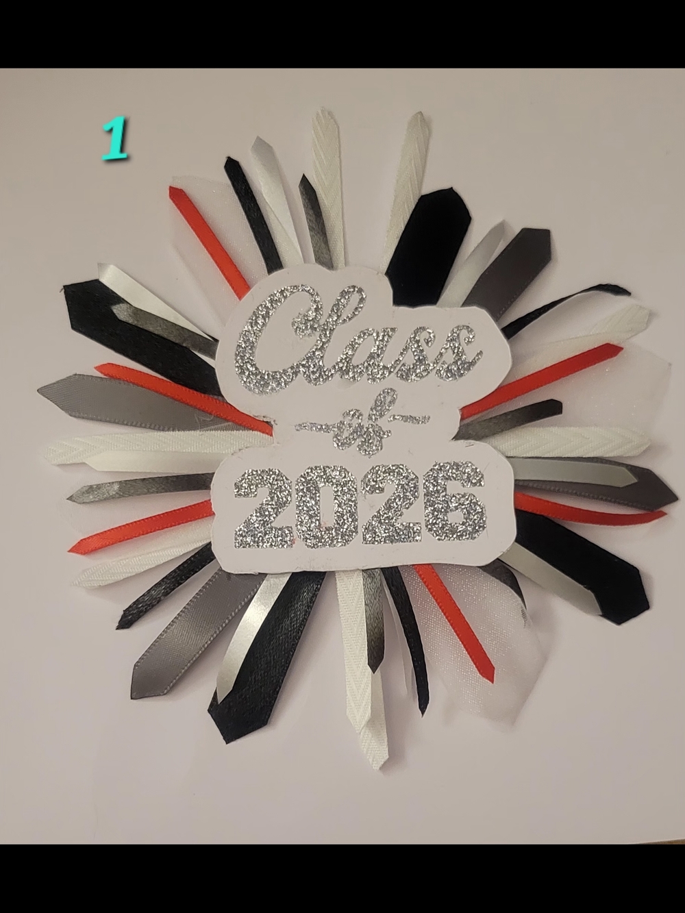 Class of 2026 Ribbon Rosette - Black, White & Silver with Red Accents.
